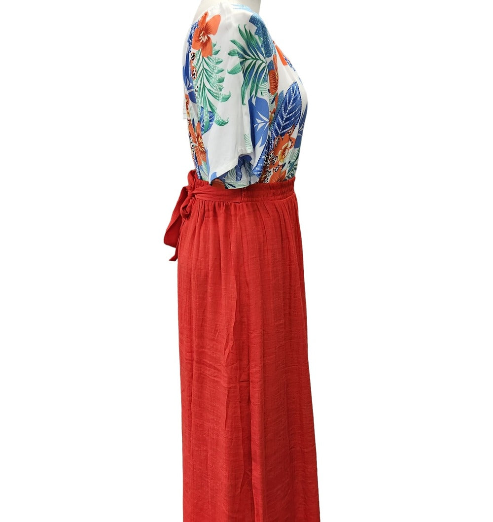 Side view of red summer skirt with elastic waistaband and button detail