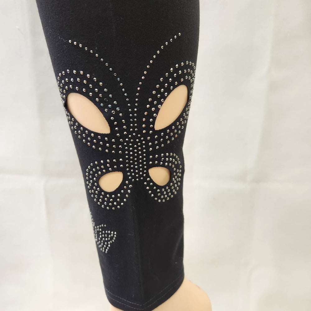 View of cut out butterfly pattern on black leggings