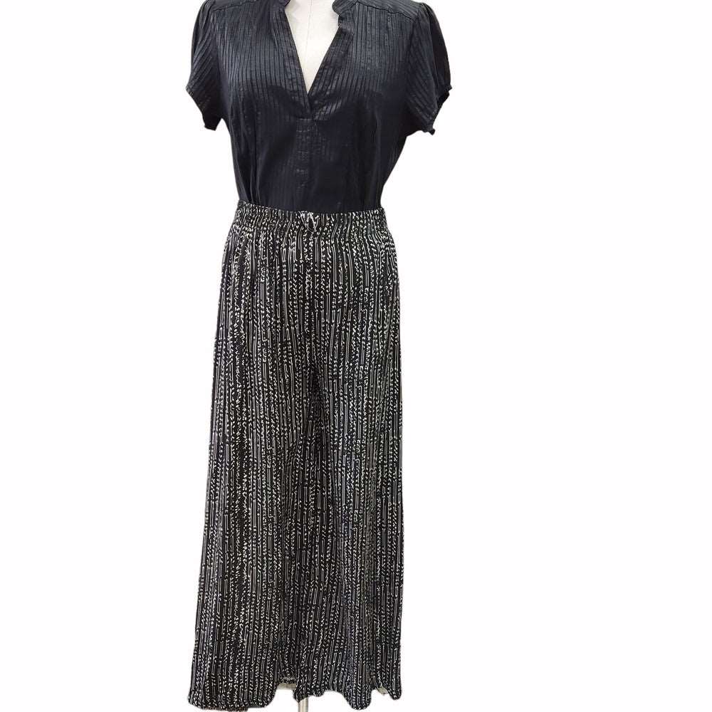 Front view of culottes with black background and white stripped print