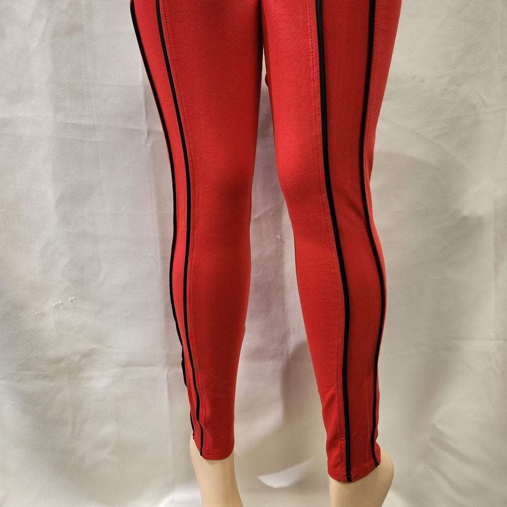 Alternative view of red leggings with black piping
