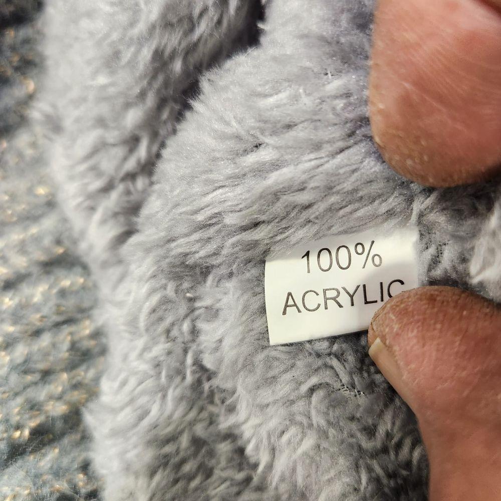 Inside tag on grey color beanie with pom pom