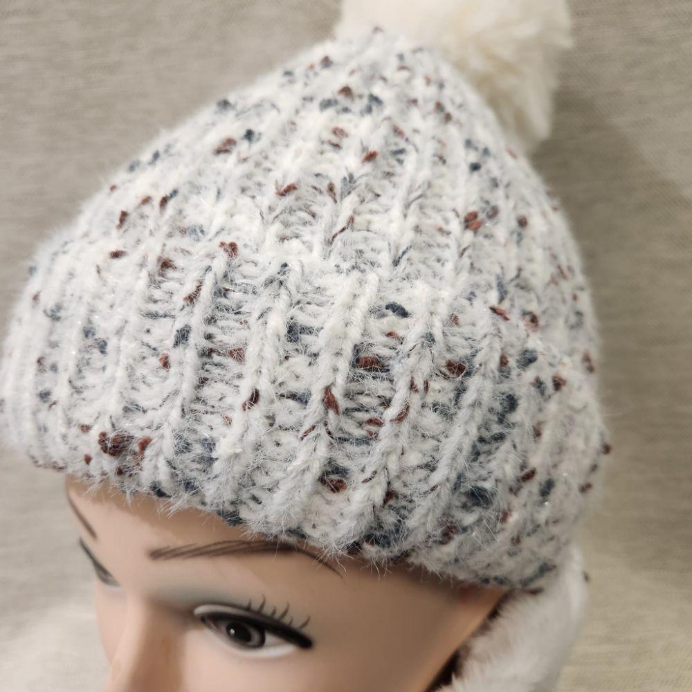 Detailed view of Winter beanie with white pom pom