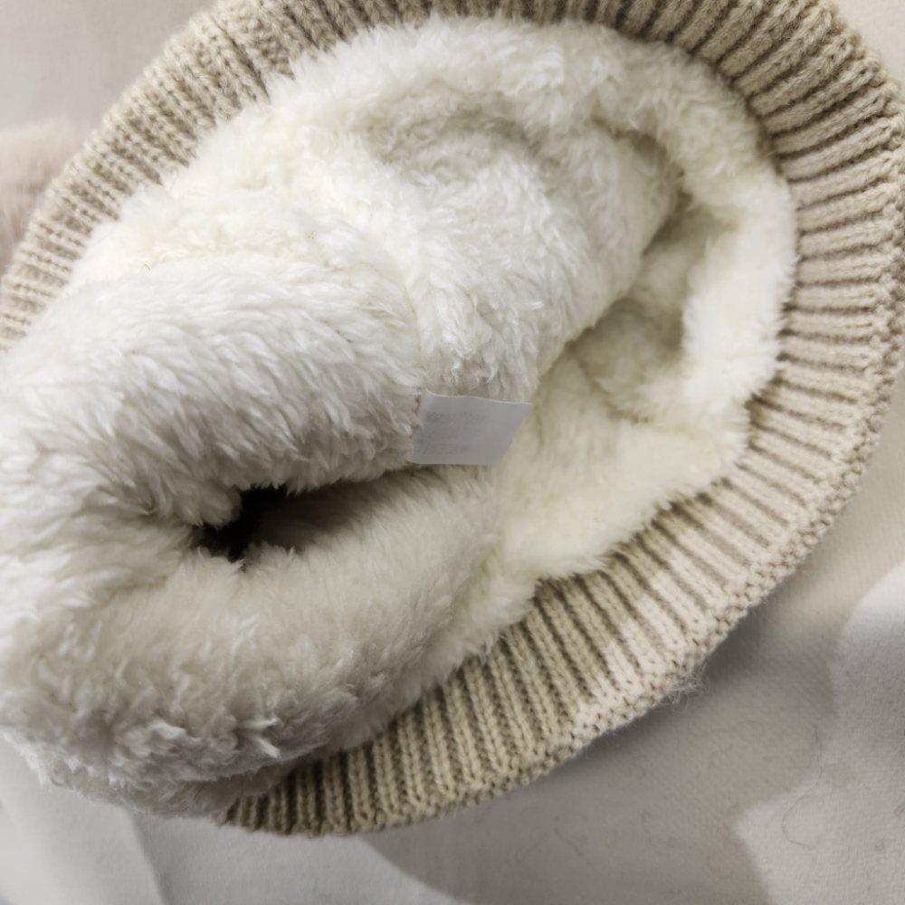 Inside of light beige rope knit beanie
