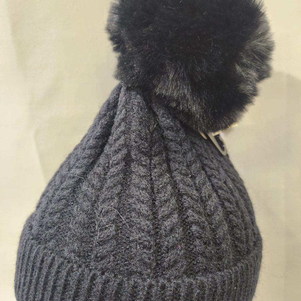 Black pom pom on rope knit beanie