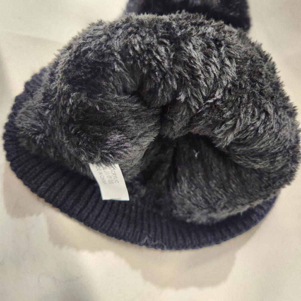 Inside of rope knit black winter beanie