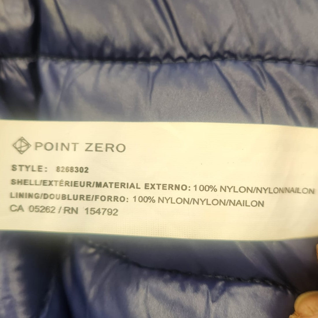 Tag regarding shell and lining of navy Point Zero jacket