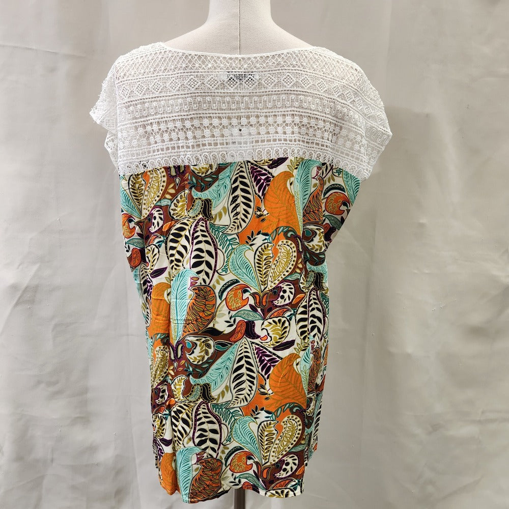 Rear view of top in vibrant print and white lace upper