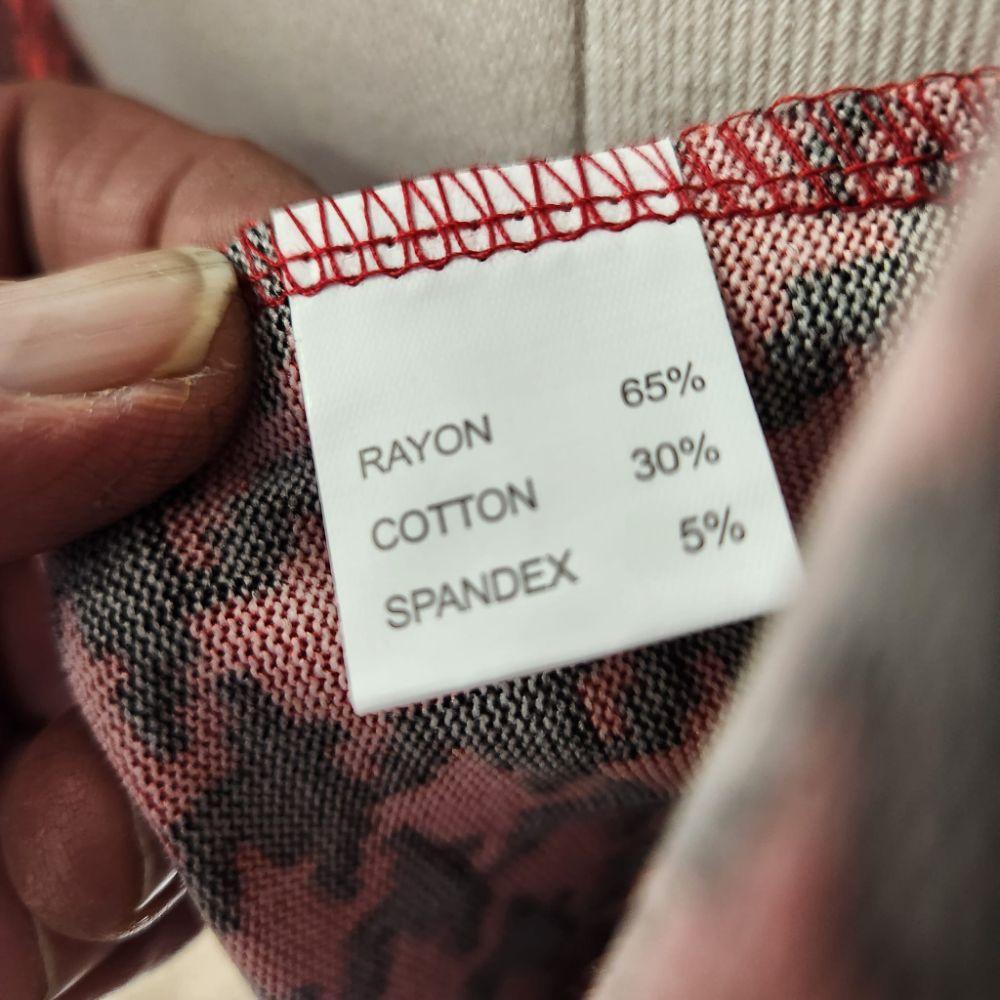 Inside tag of red and black shawl collar top