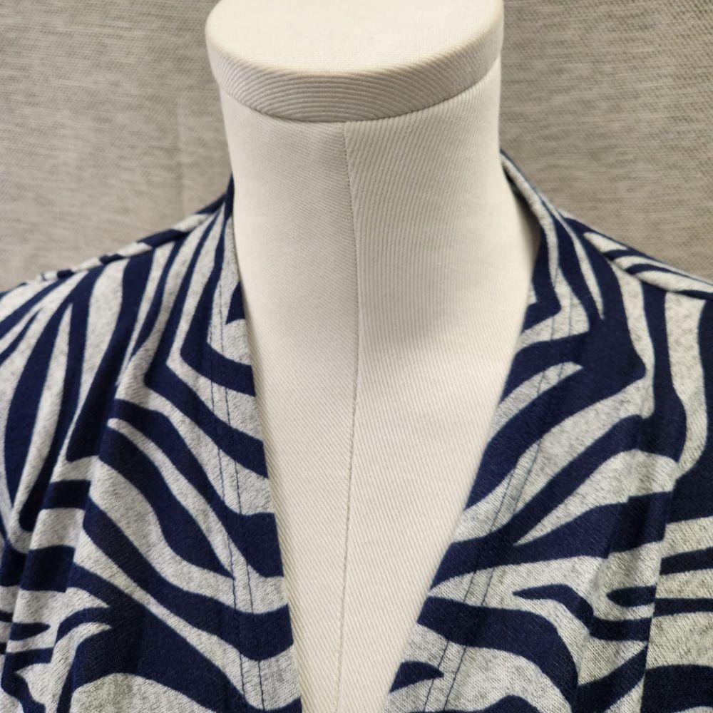 Another detailed view of grey with blue animal print top