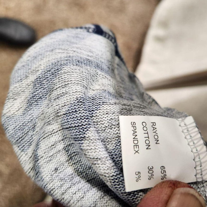 Inside tag on blue with grey animal print top