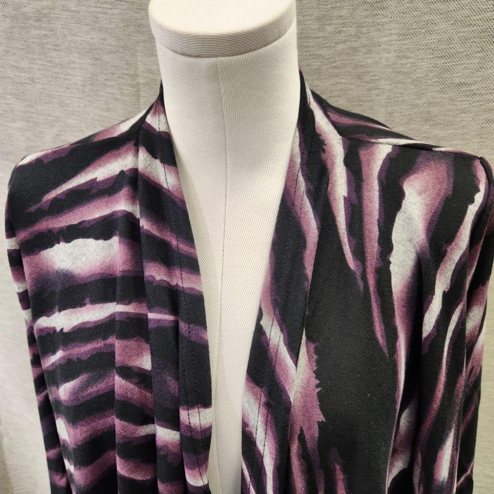 Another detailed view of Light open front top in animal print