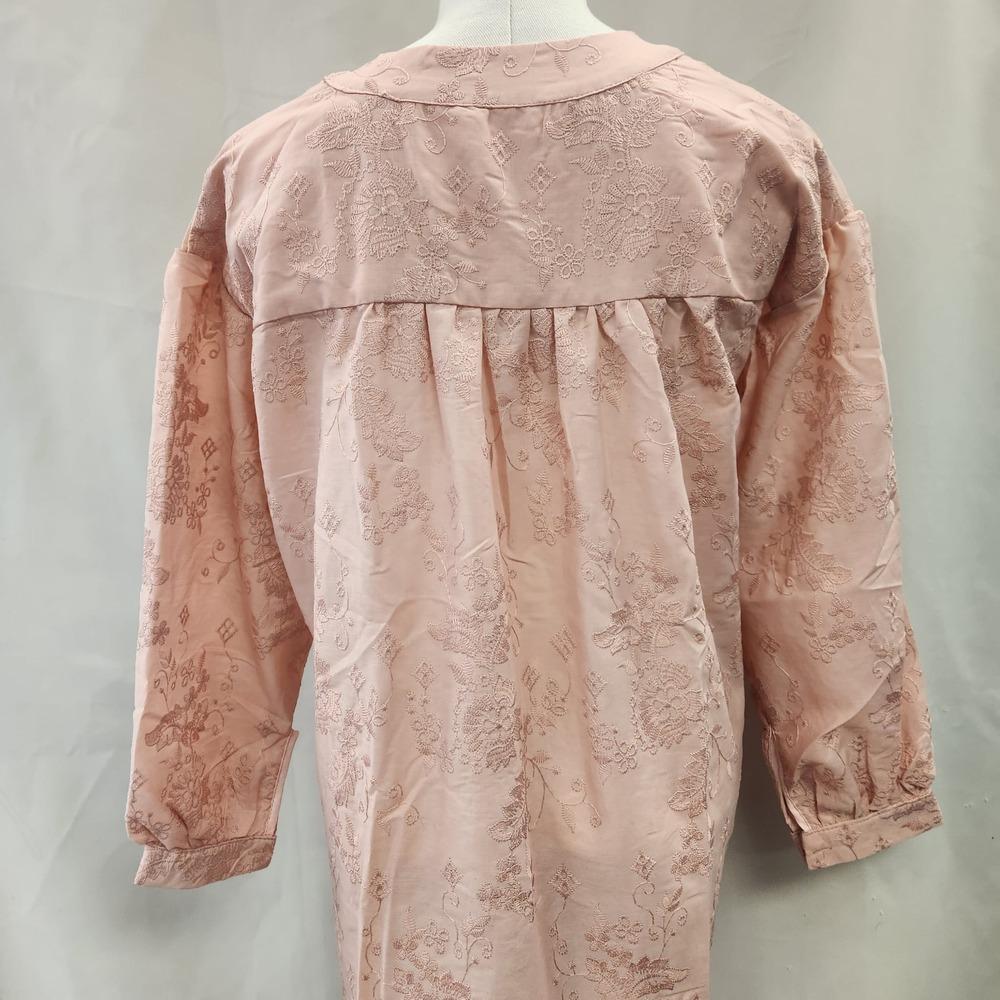 Rear view of Peach buttoned front long sleeve top