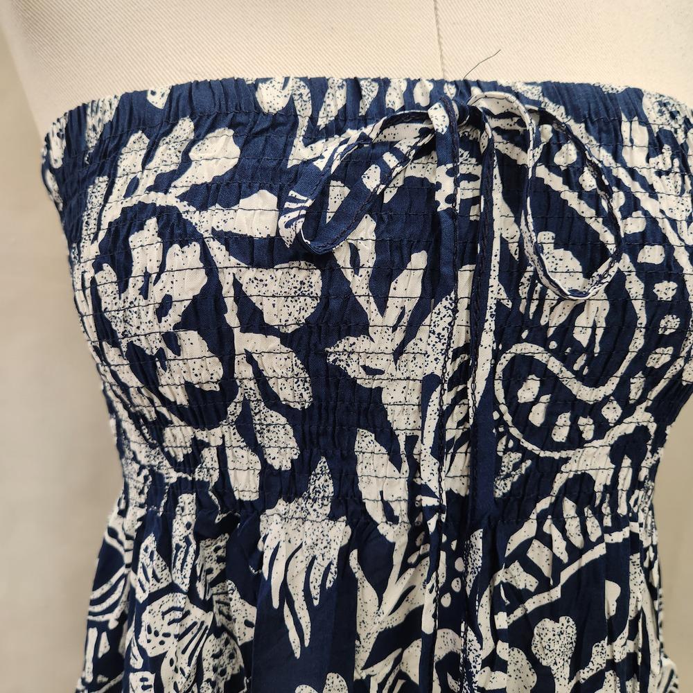 Smocked upper of navy blue and white top