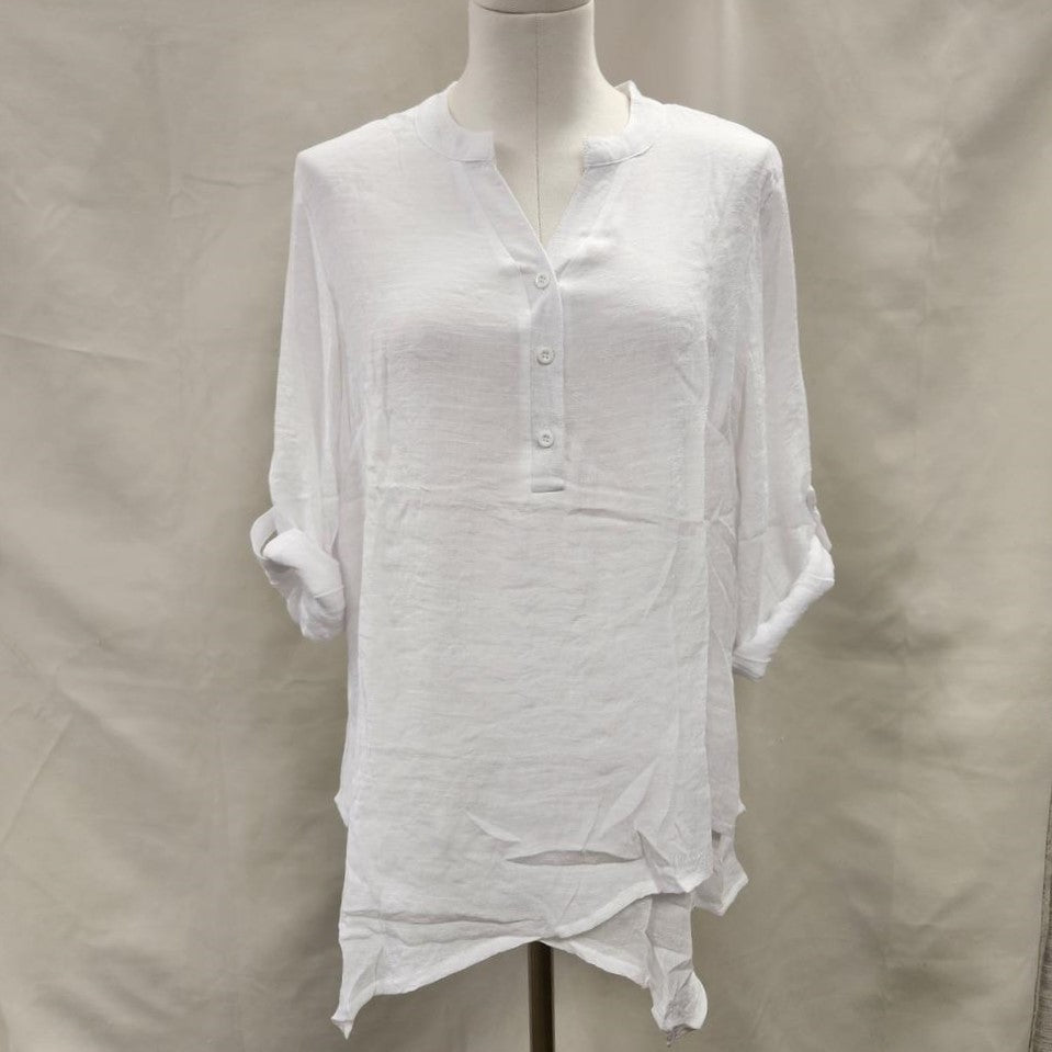 Layered white summer top with sleeves rolled up