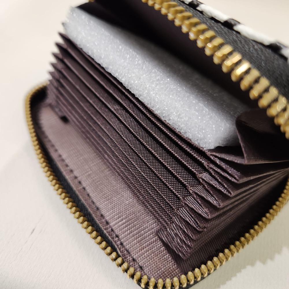 Detailed view of Black and white houndstooth pattern card holder