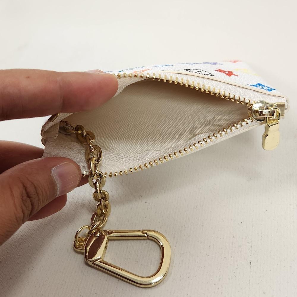White with colorful floral print coin purse when opened