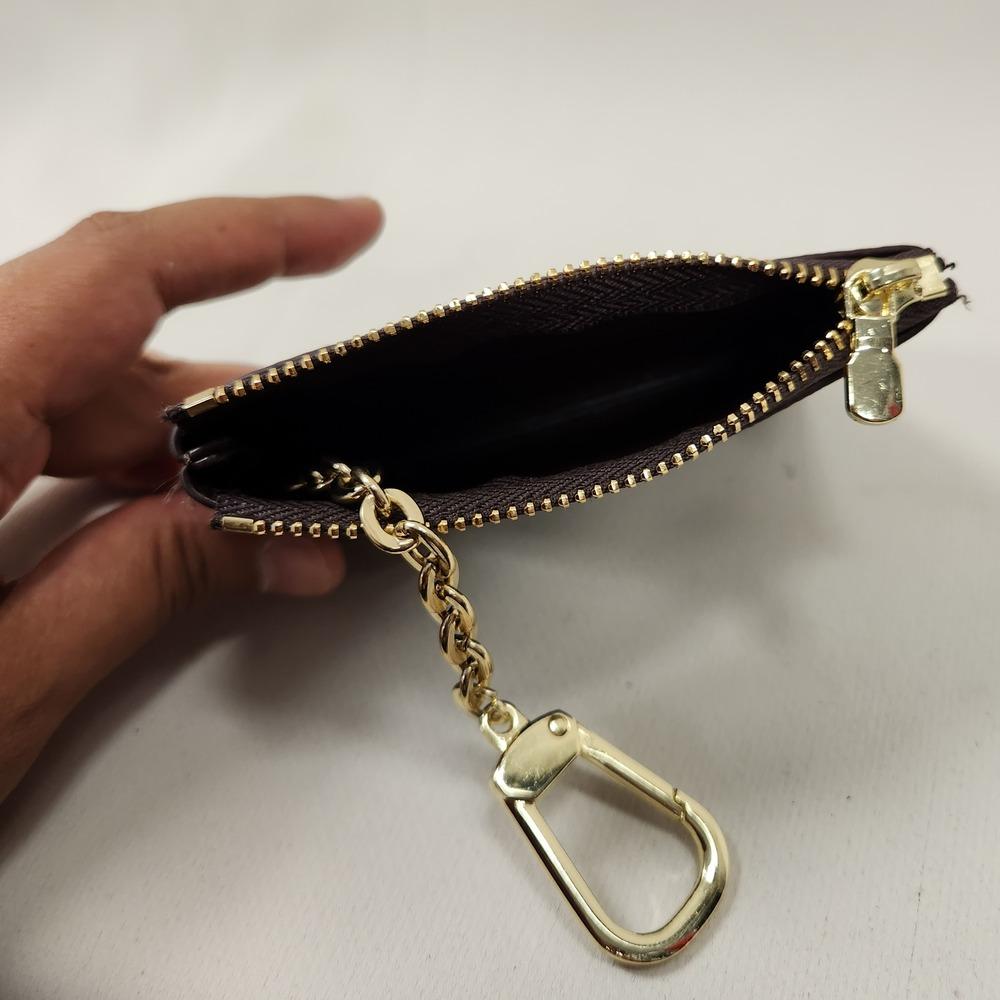 Light and dark brown checkered print coin purse when opened