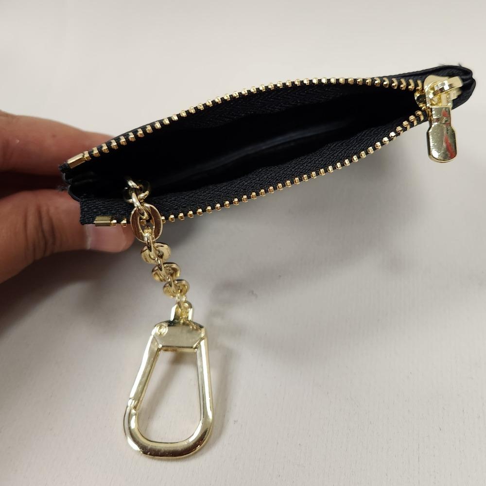Black and grey checkered print coin purse when opened