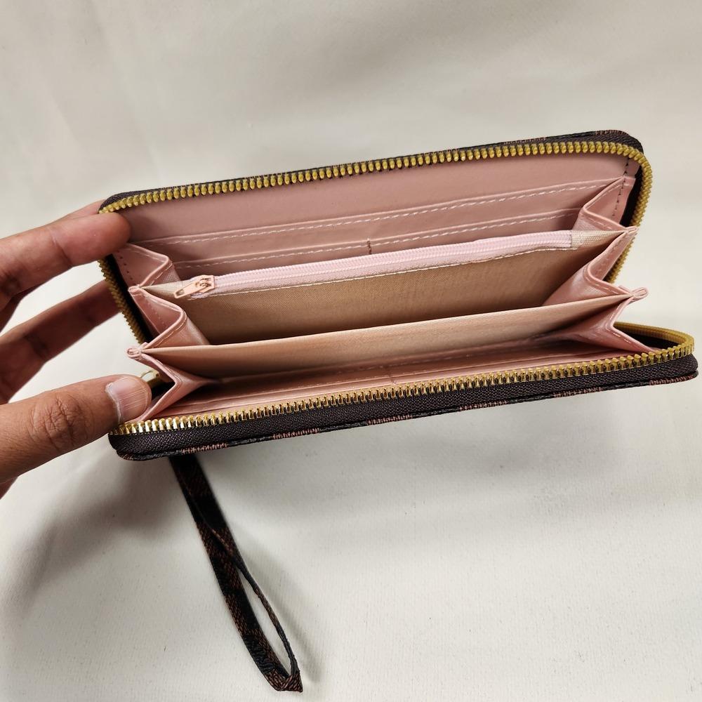 Wallet in checkered print with zip closure and wrist strap when opened