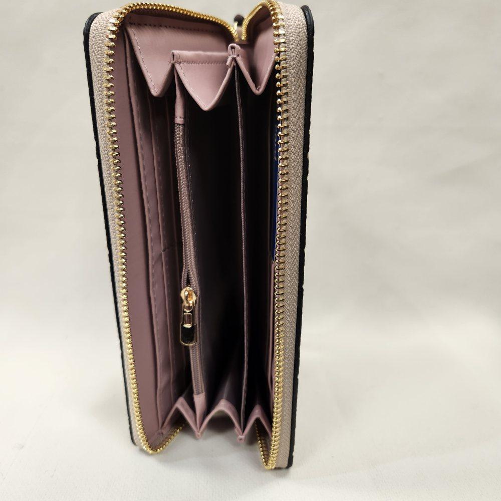 Inner view of beige wallet with brown floral pattern