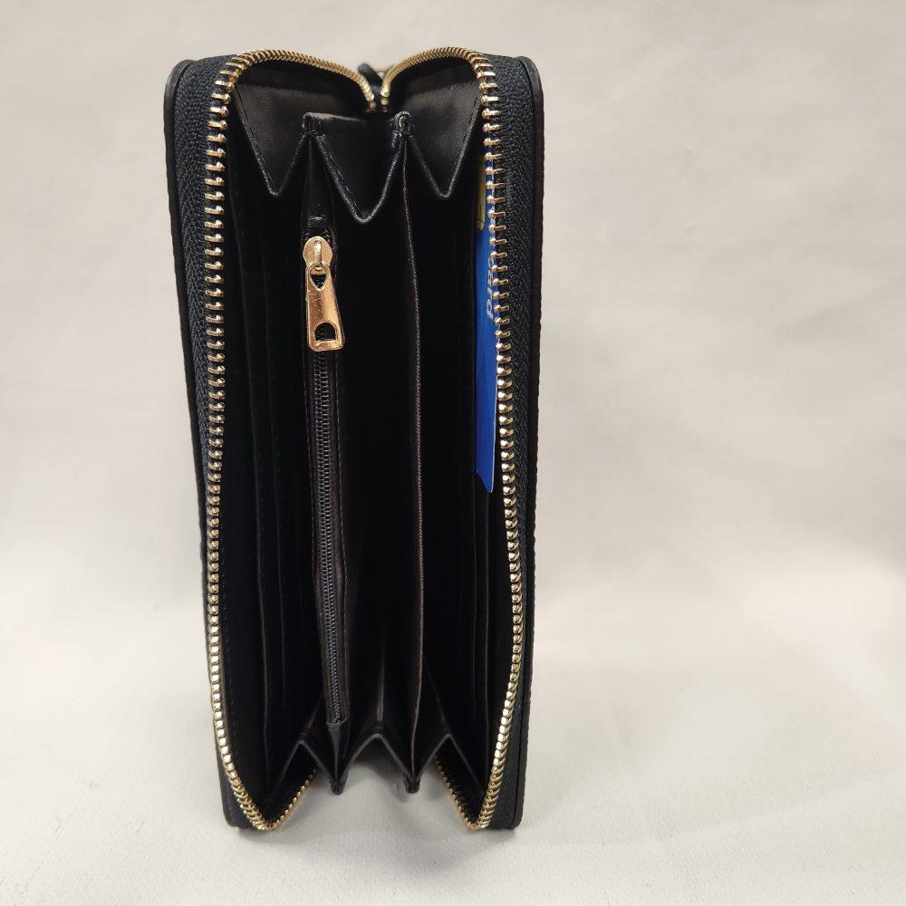 Inside view of Black wallet with engraved floral pattern and a wrist strap