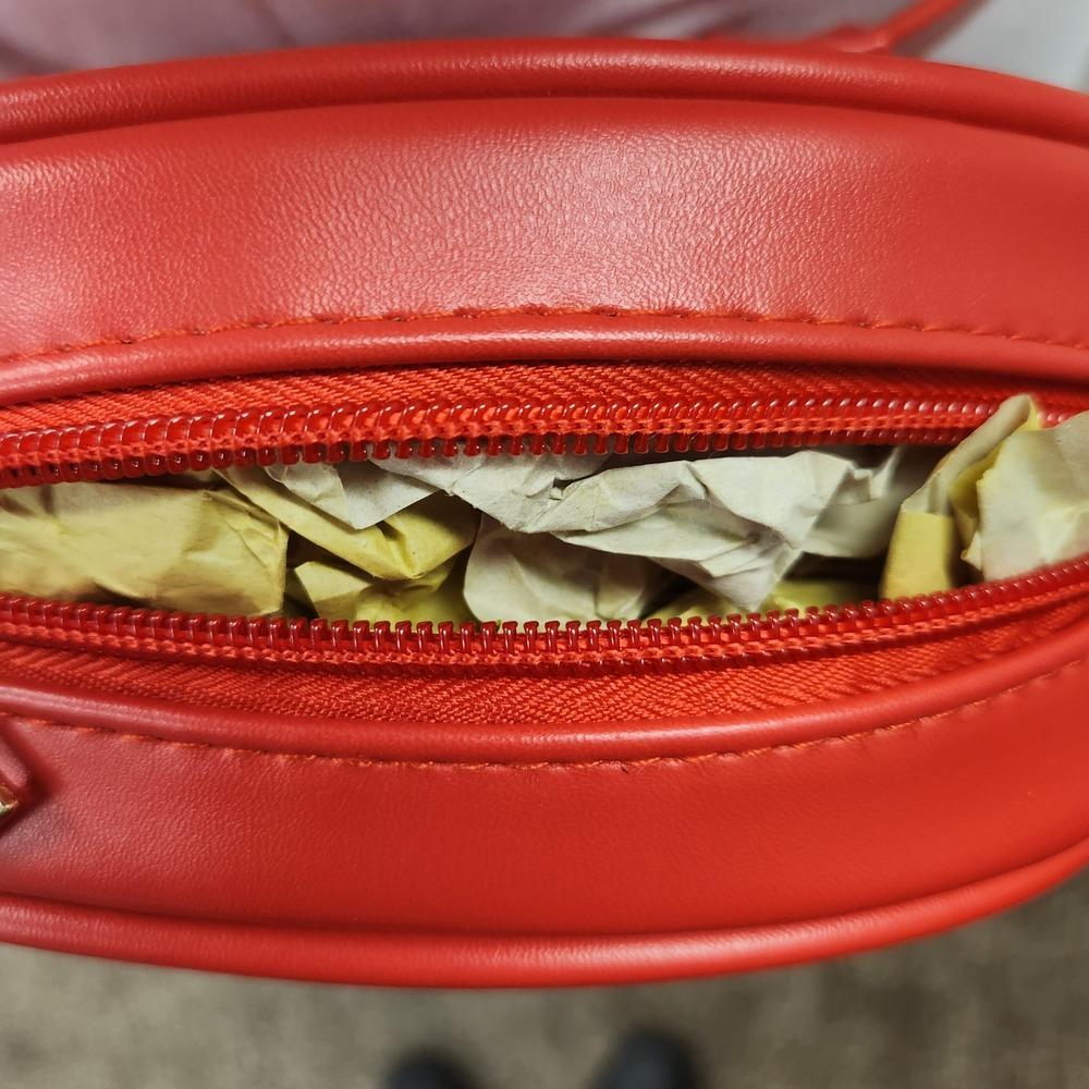 Inside view of compartment of red pouch