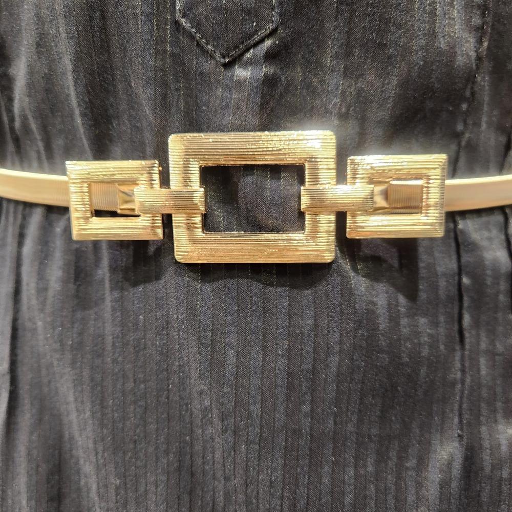 Detailed view of decorative gold buckle