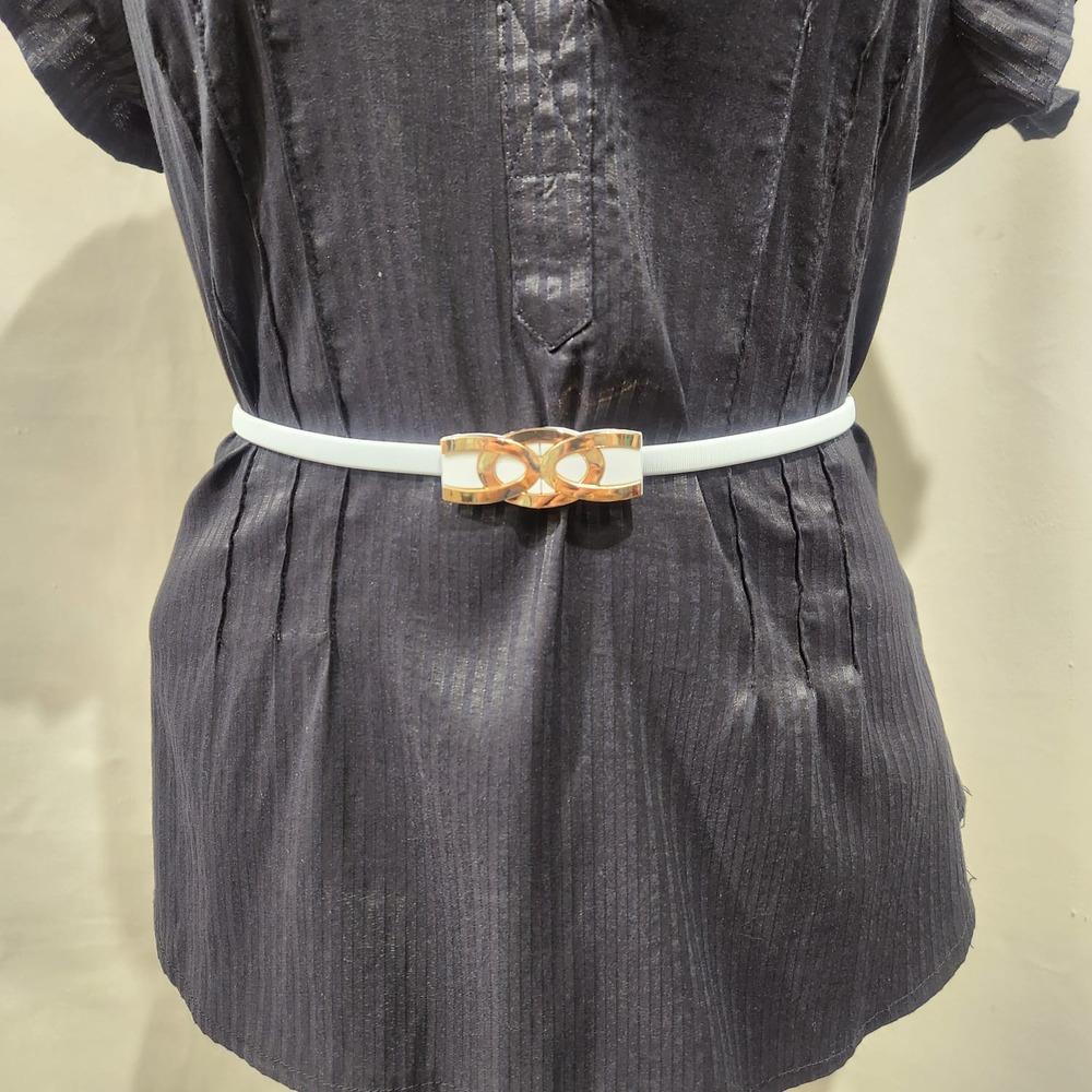Detailed view of White stretchy belt with stylish gold buckle