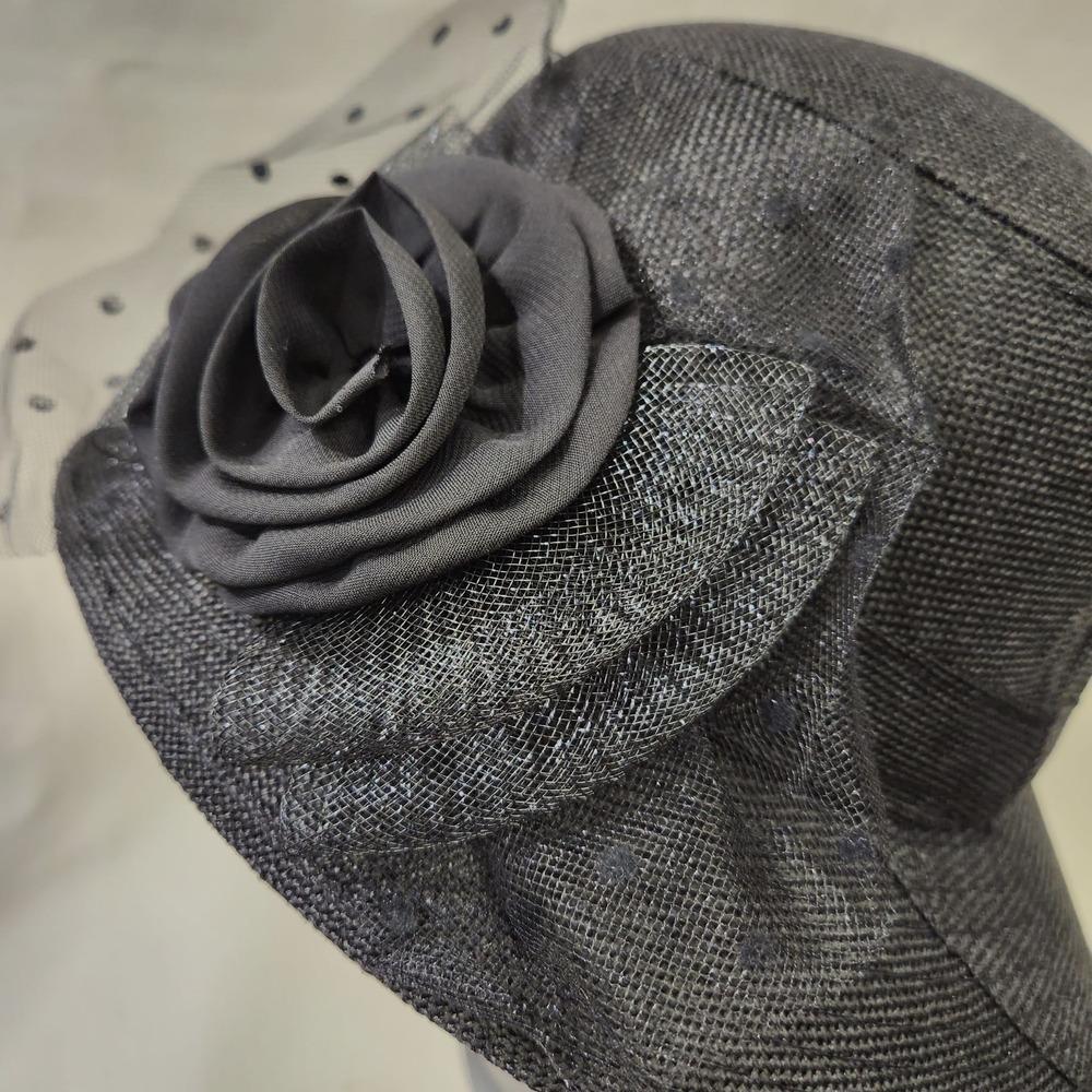Embellishment on black cloche hat