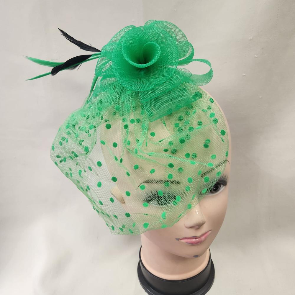 Another view of Green fascinator with mesh and feather detail