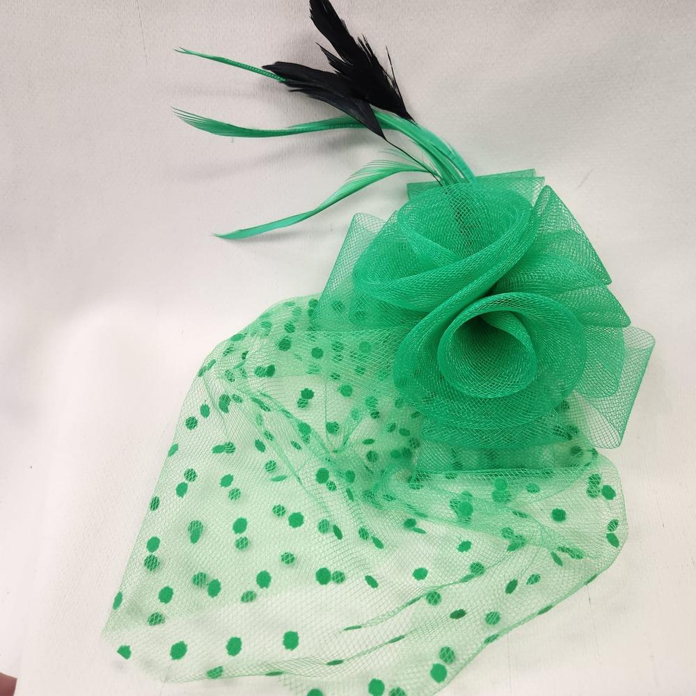 Green mesh and feather adorned fascinator