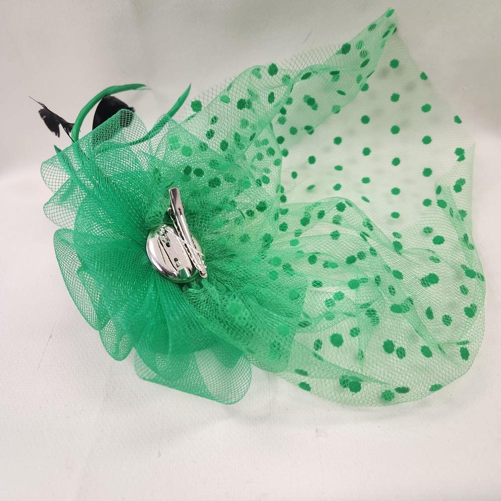 Rear view of green fascinator