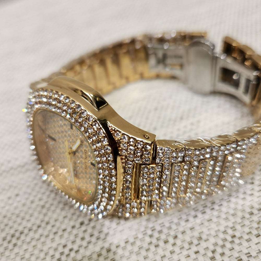 Side view of gold wrist watch