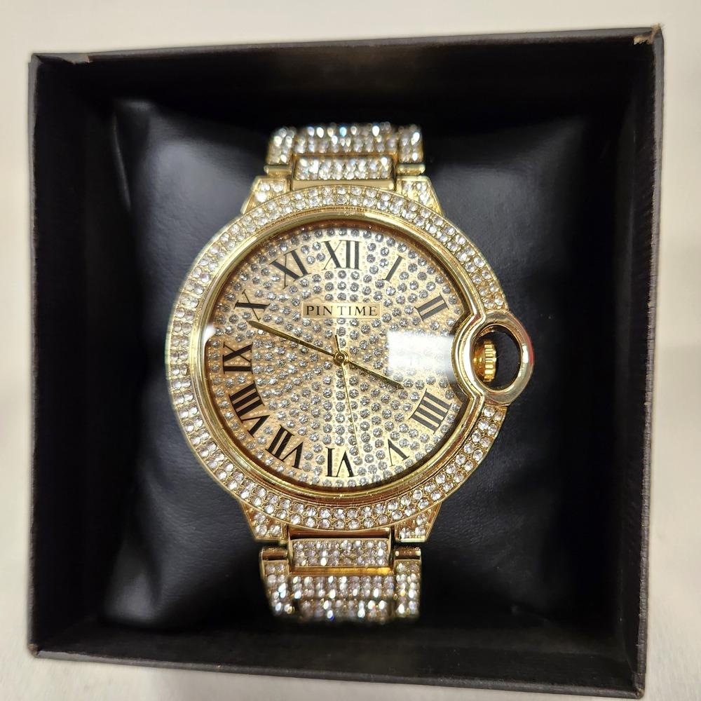 Another view of Round face watch with stone embellished strap and dial