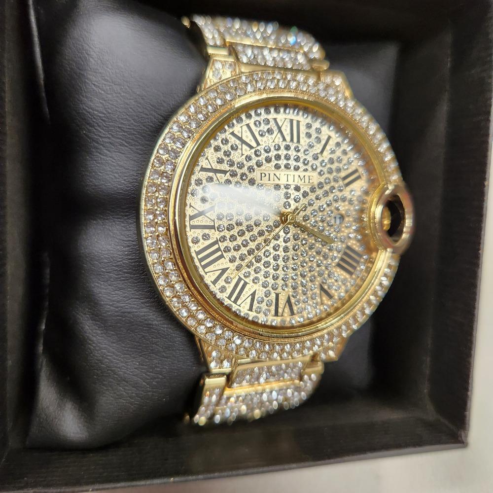 Side view of Round face watch with stone embellished strap and dial
