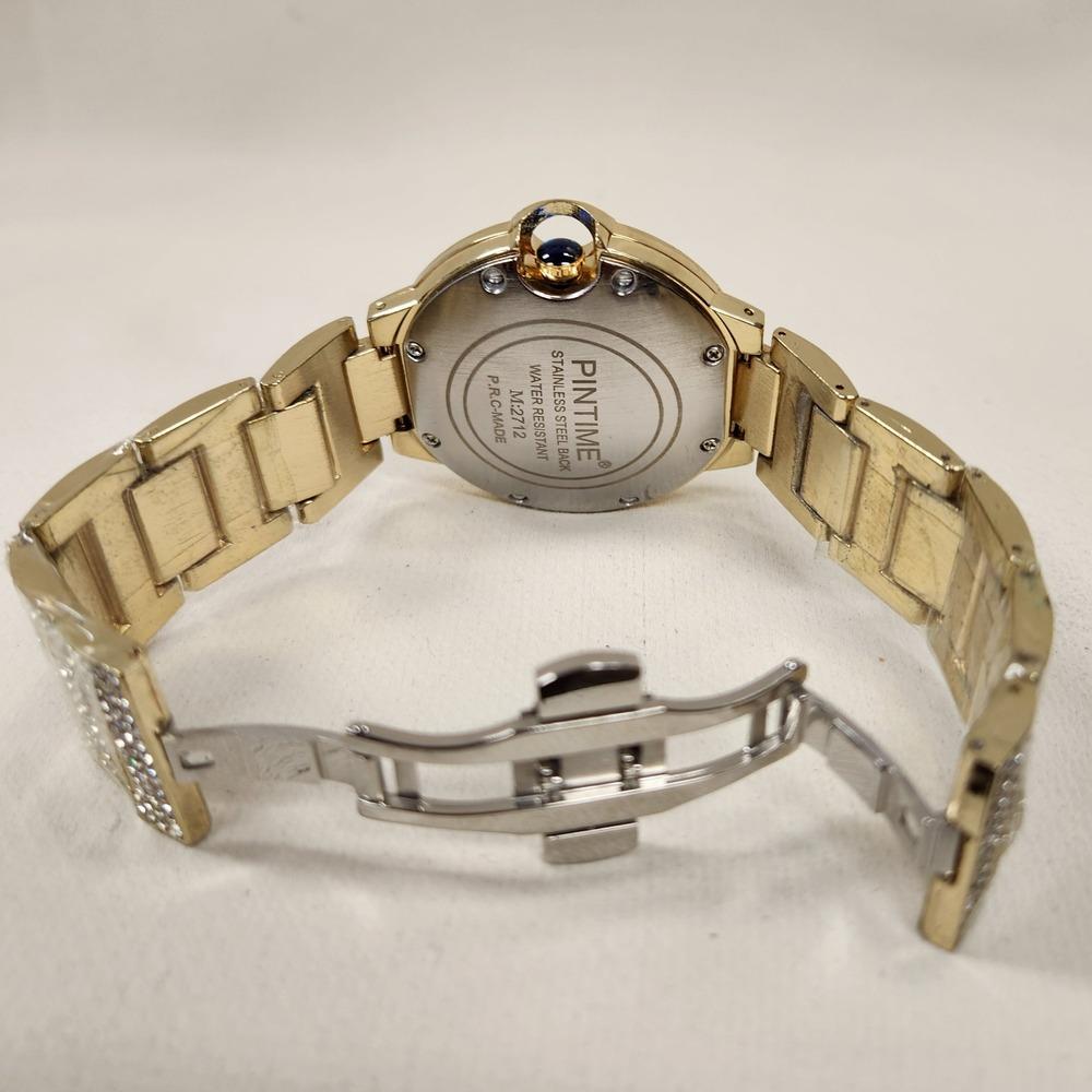 Butterfly clasp of stone studded gold watch