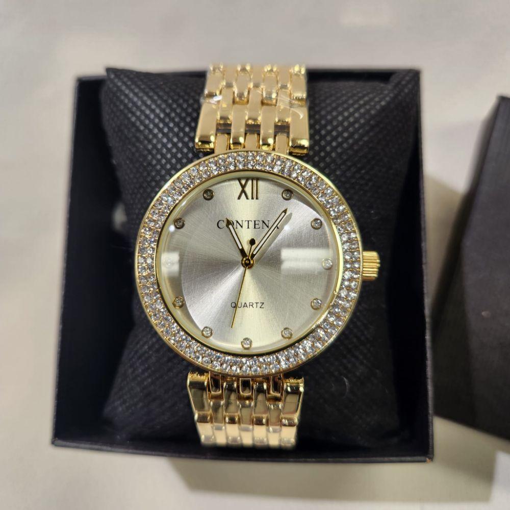 Detailed view of Wristwatch for women with white inner dial and stone studded rim