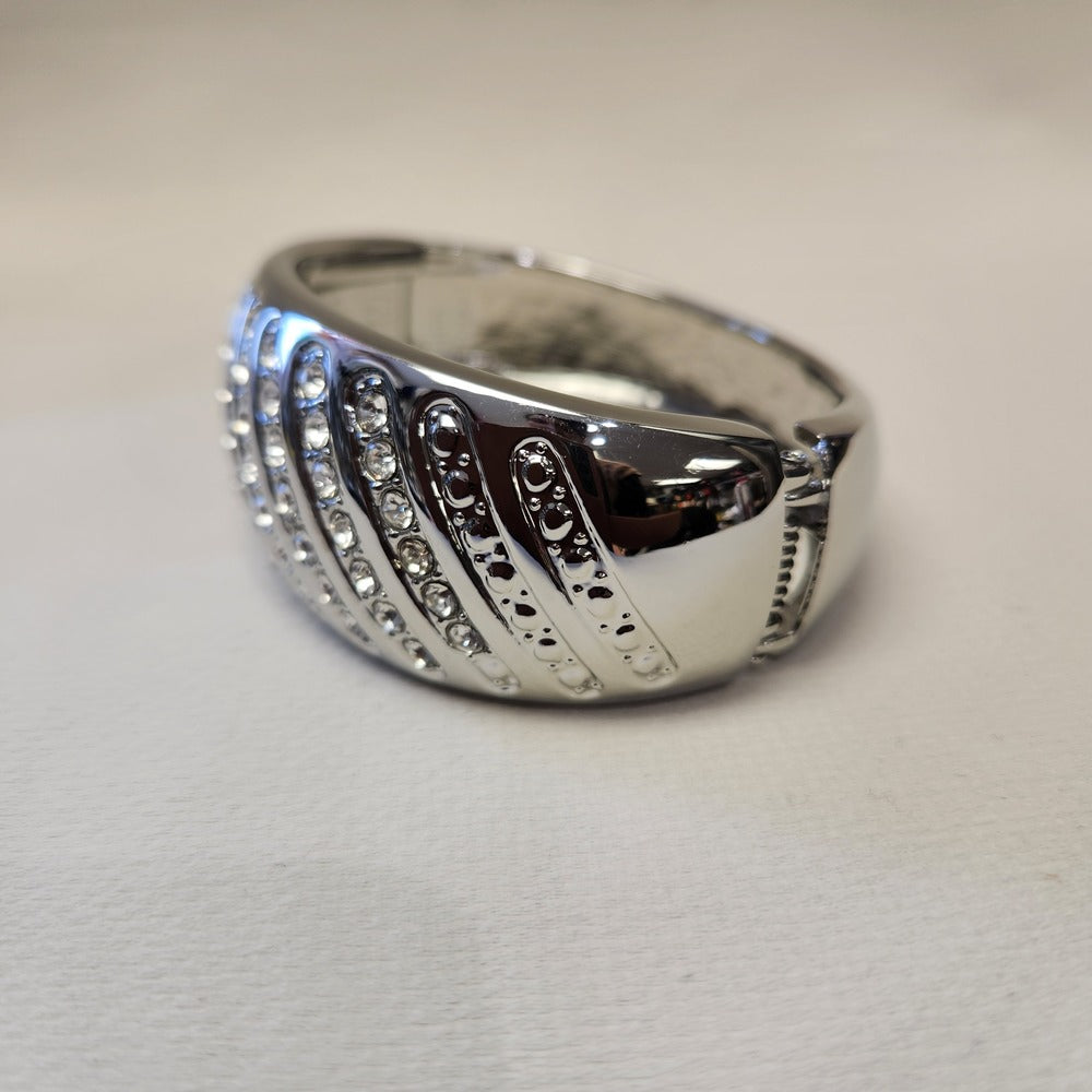 Detailed view of hinged silver bracelet