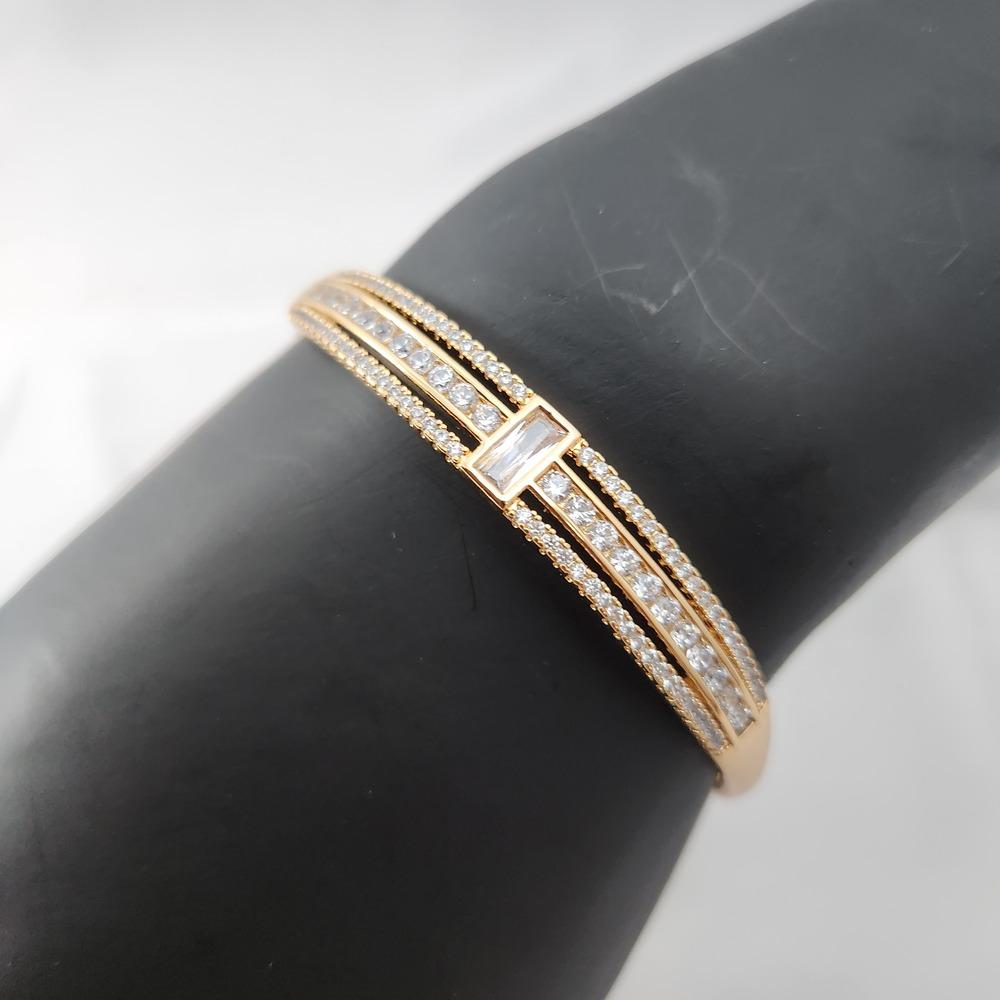 Detailed view of bracelet with baguette and round stones