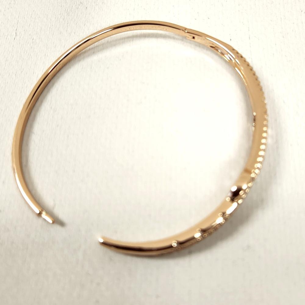 Dainty gold bracelet with clear stones when opened