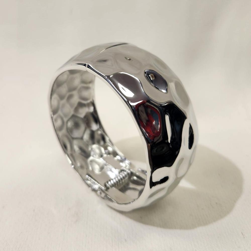 Another view of Textured silver hinged bracelet