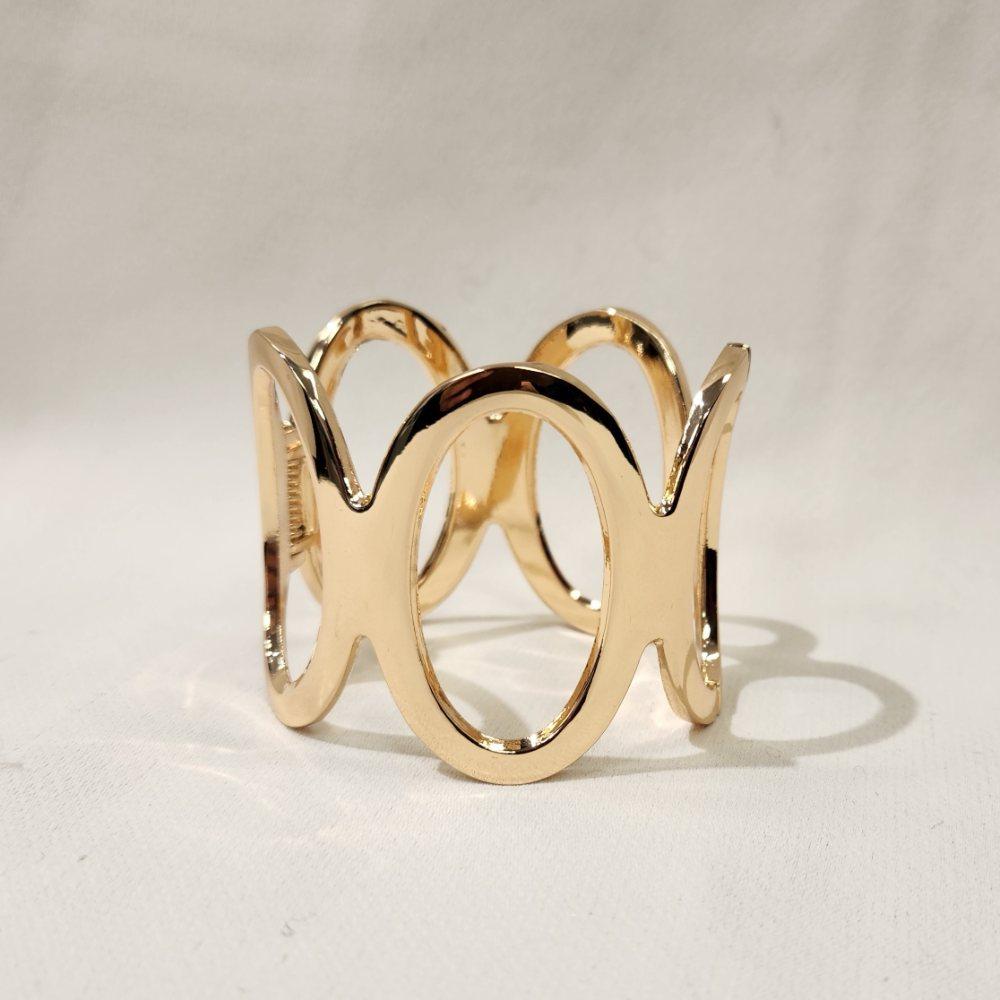 Detailed view of trendy gold hinged bracelet