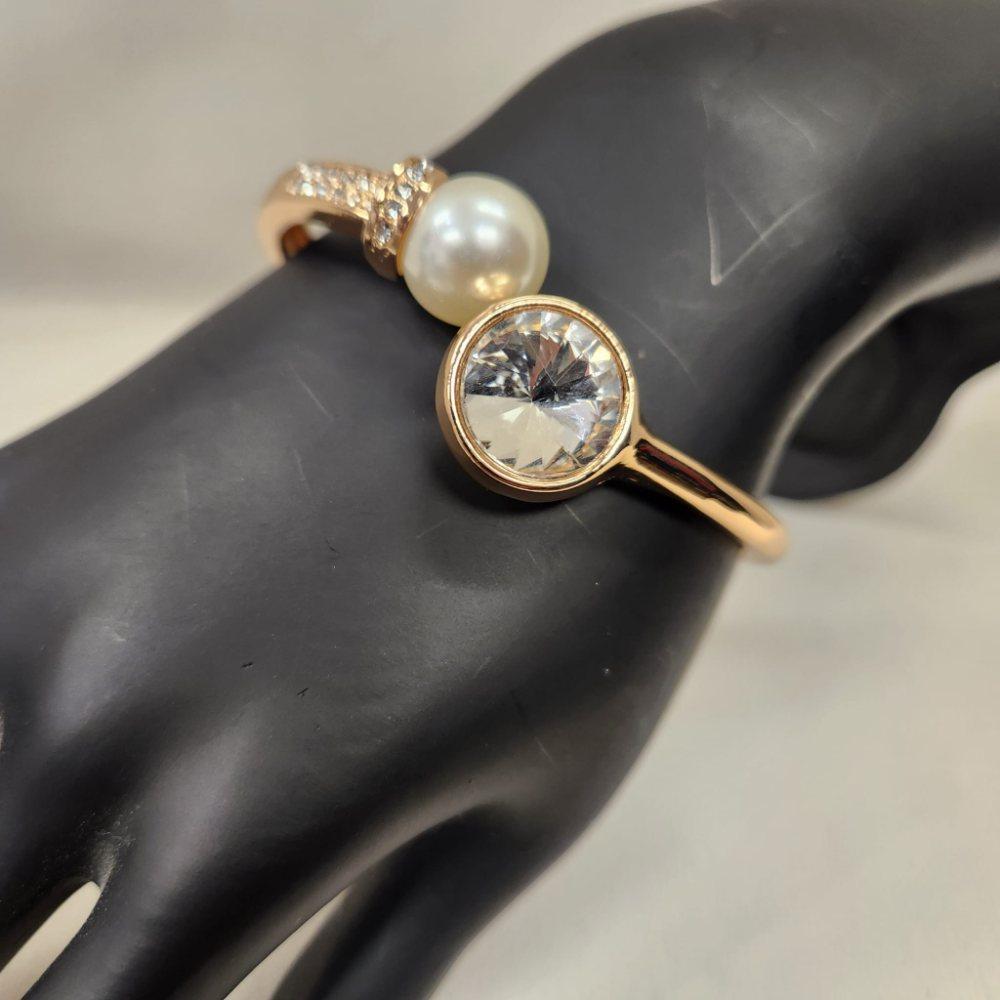 Another view of Gold bracelet with clear stones and pearl