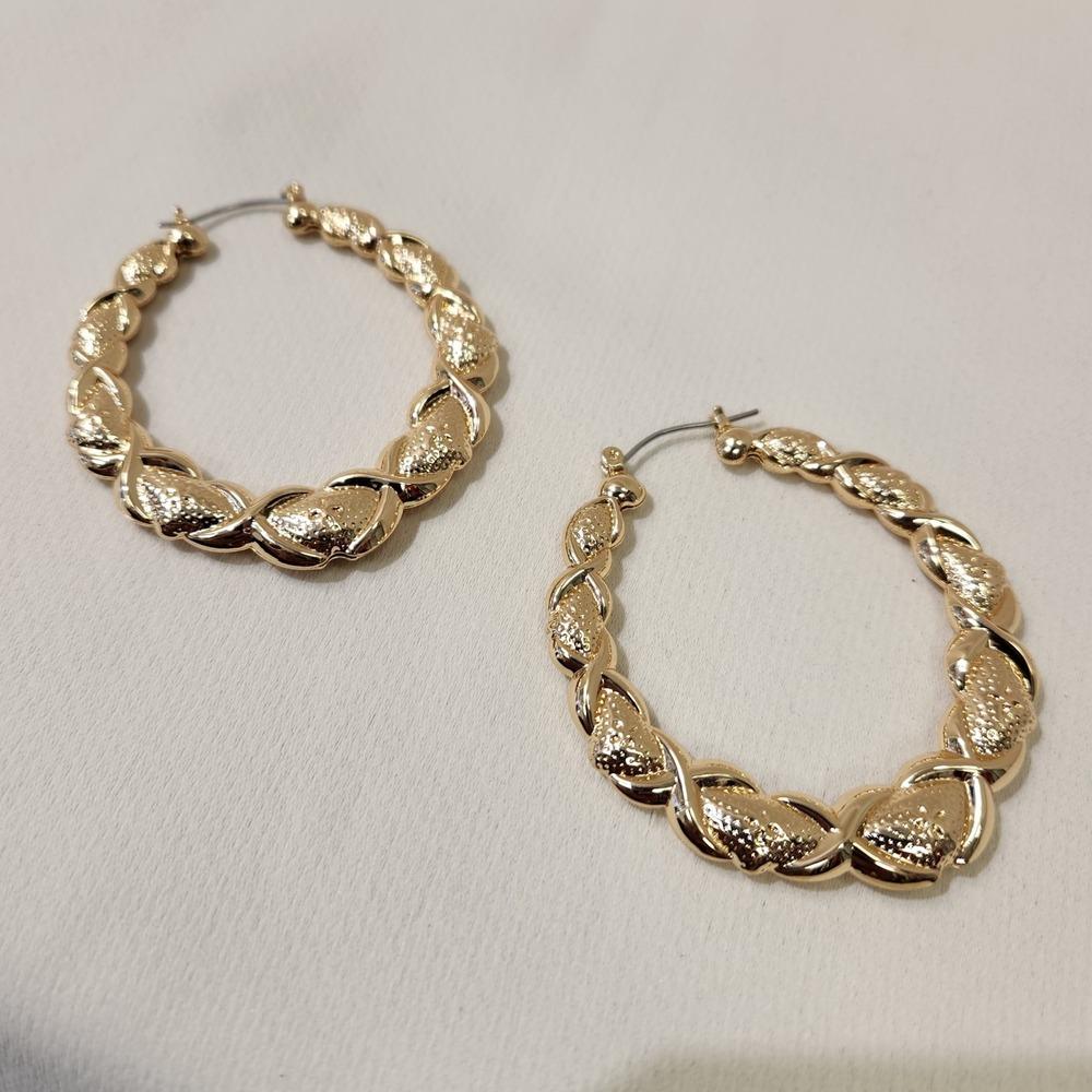 Alternative view of bold gold colored hoop earrings