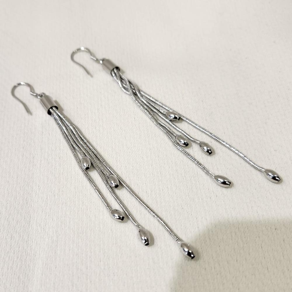 Another view of Long silver color dangle earrings with oval beads