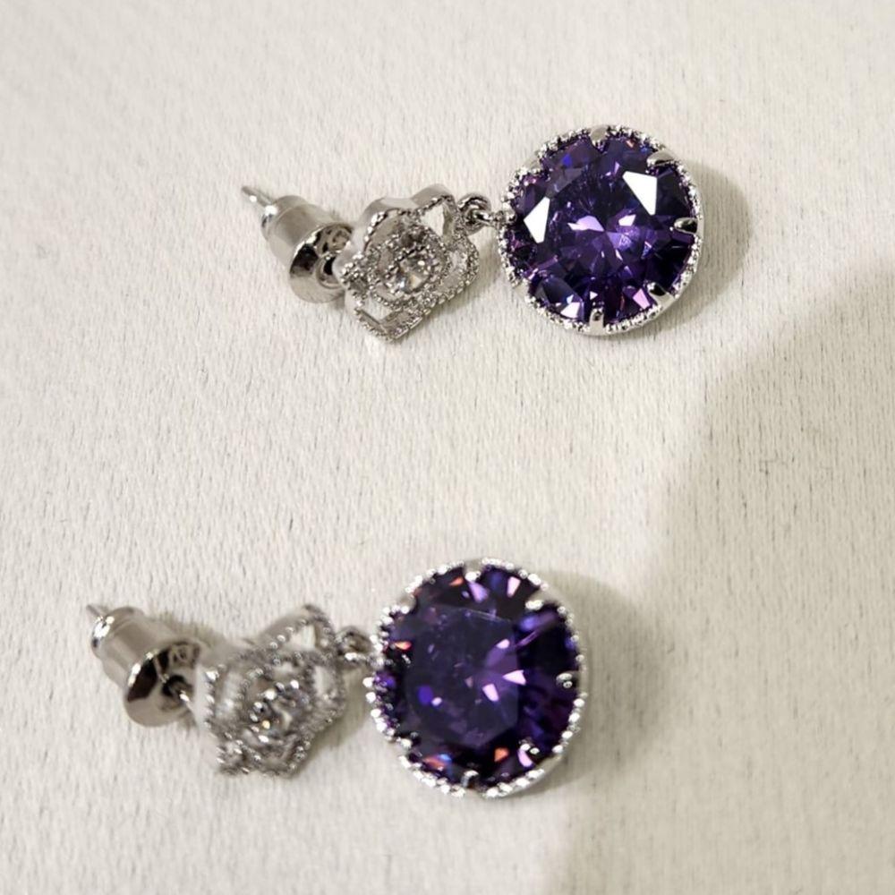 Pushback post on earrings with clear and purple stone