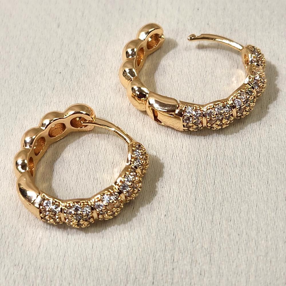 Latch back post of Gold ribbed huggie hoop earrings
