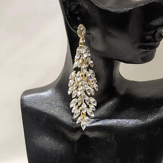 Gold frame dangle earrings with clear stones