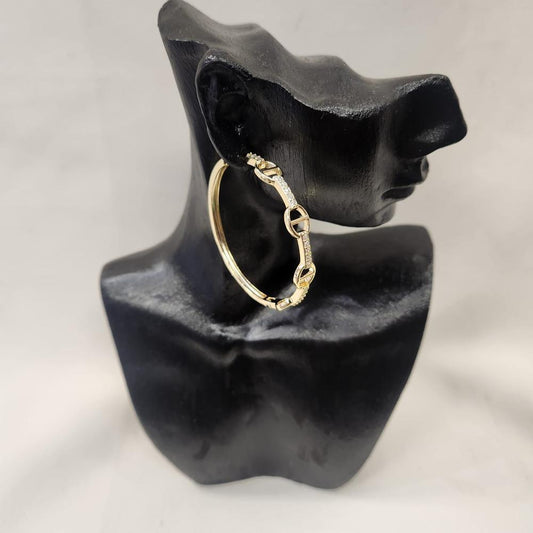 Large gold hoop earrings with stones