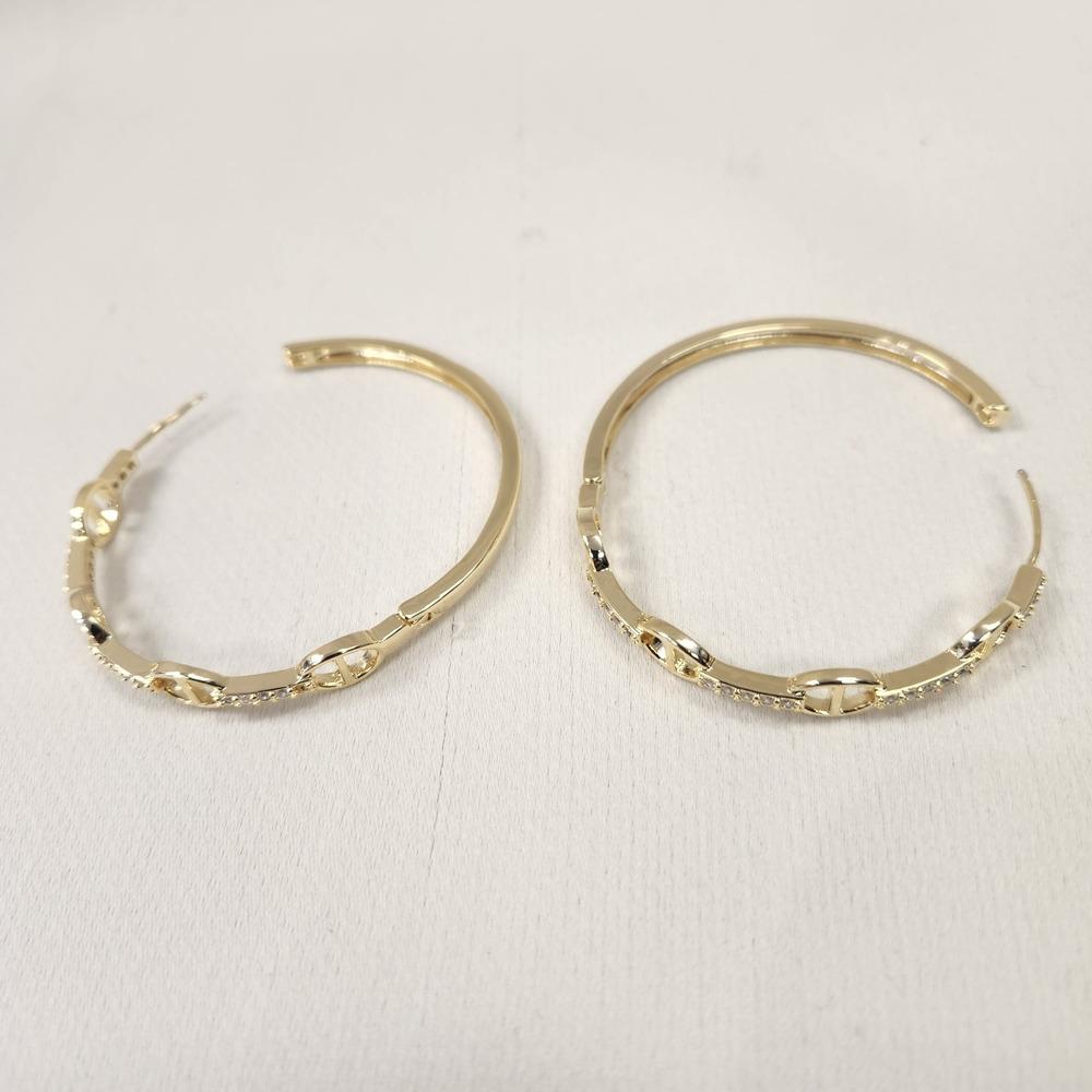 Latch back post of large gold hoop earrings